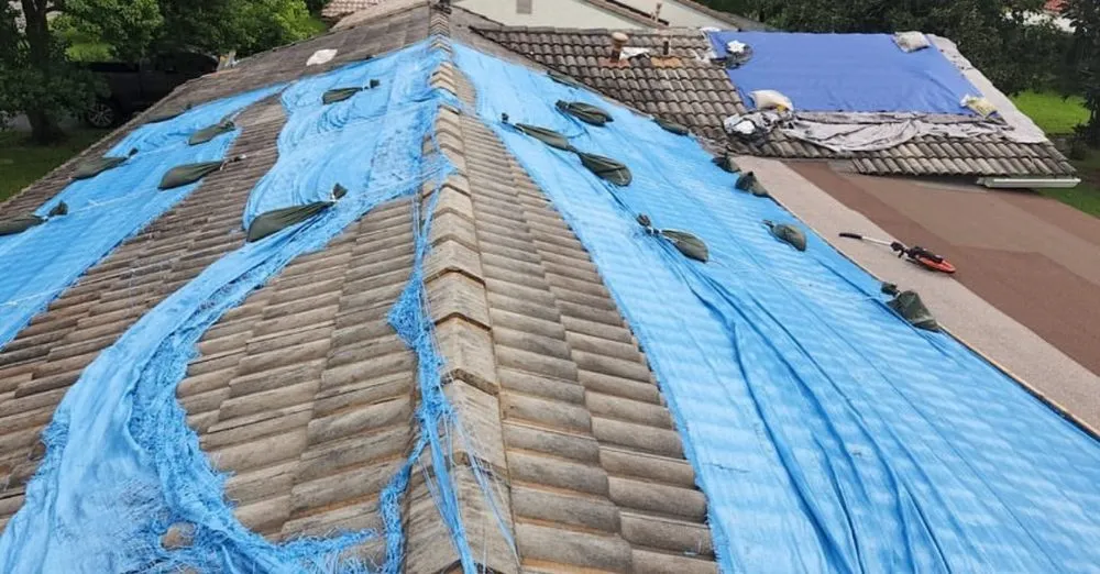 Slide of 305 Roof Tarps