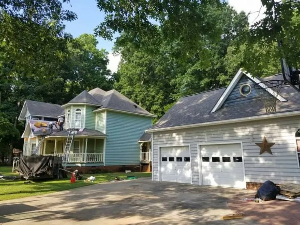 Emergency roof leak repair after storm damage in McLeansville, NC by 336 Roofing Company