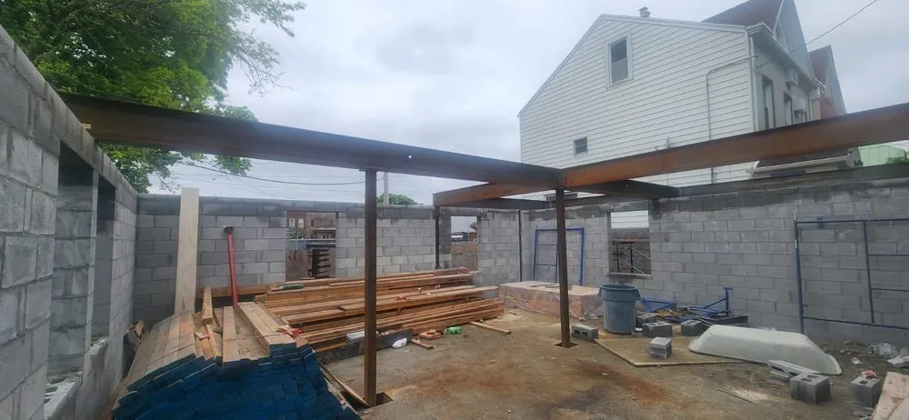 Licensed flat roof repair experts serving South Richmond Hill, NY - 9 Yards Builders