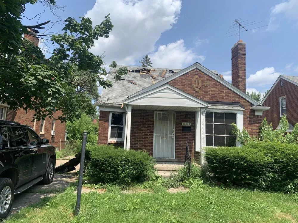 Slide of A J E Roofing