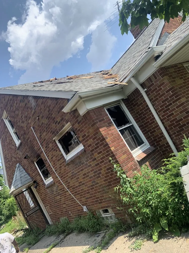 Slide of A J E Roofing