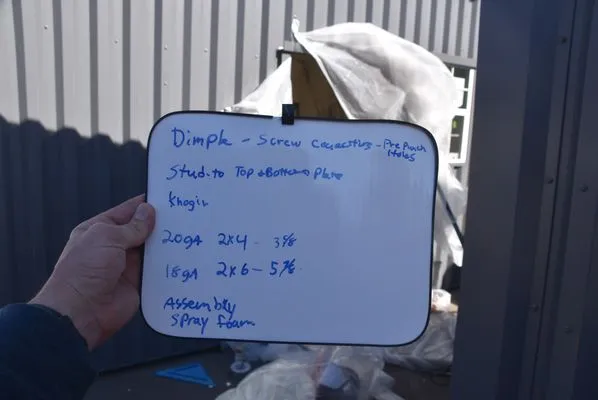 A. J. Wells Roofing & Construction Logo