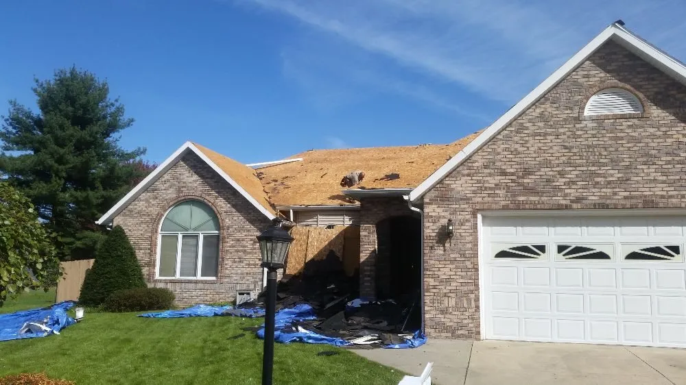 Emergency storm damage roof repair in Berrien Center, MI by A L Shembarger Roofing