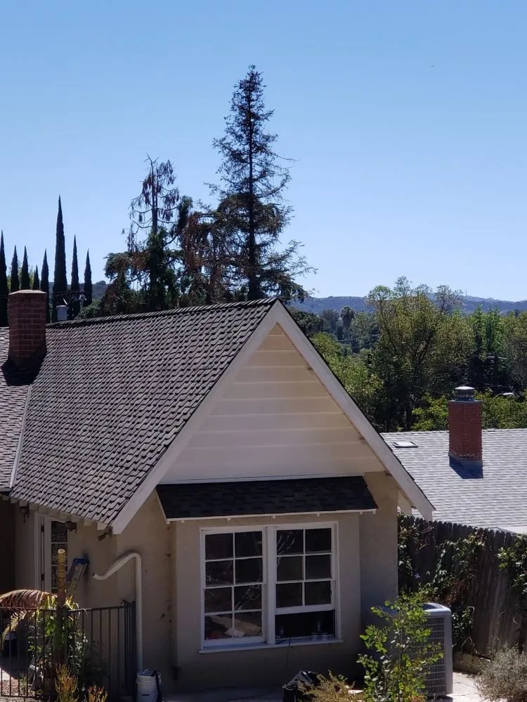 Slide of A Precision Roofing