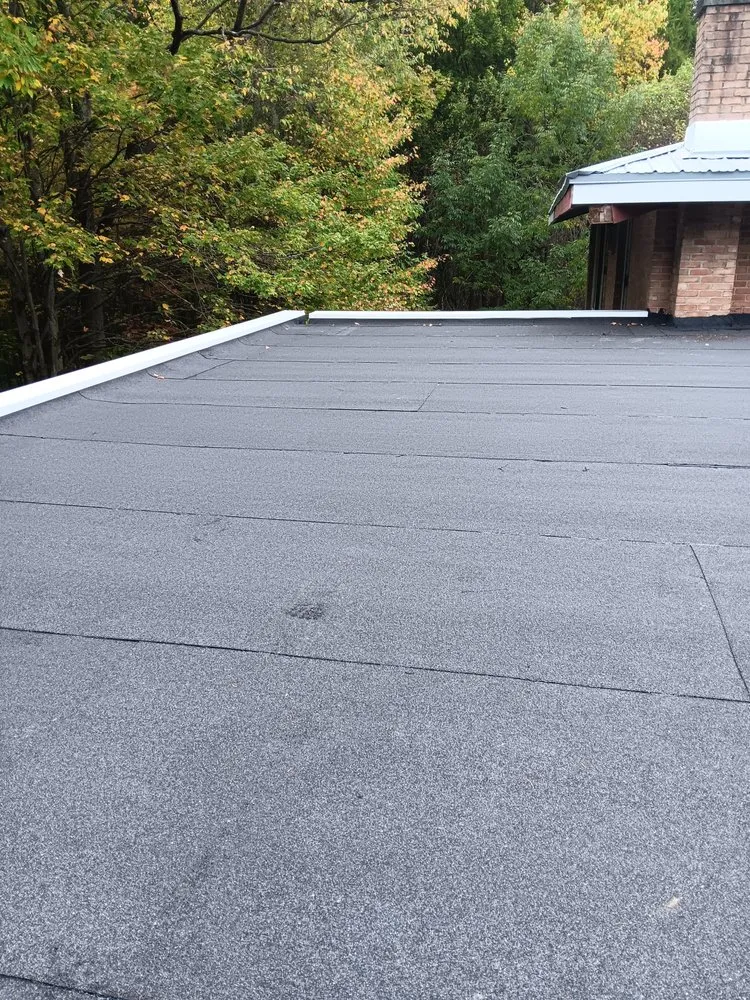 Slide of A Team Metal Roofing