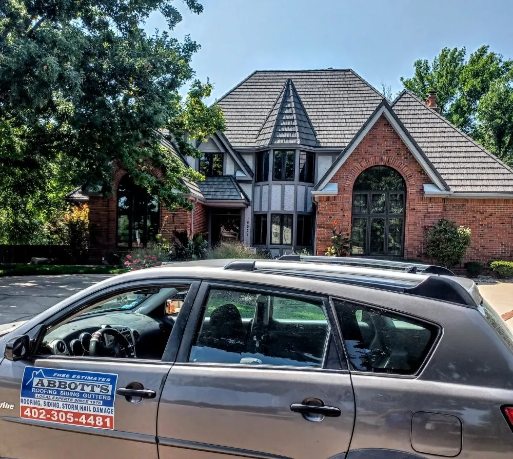 Slide of Abbotts Roofing Siding Gutters