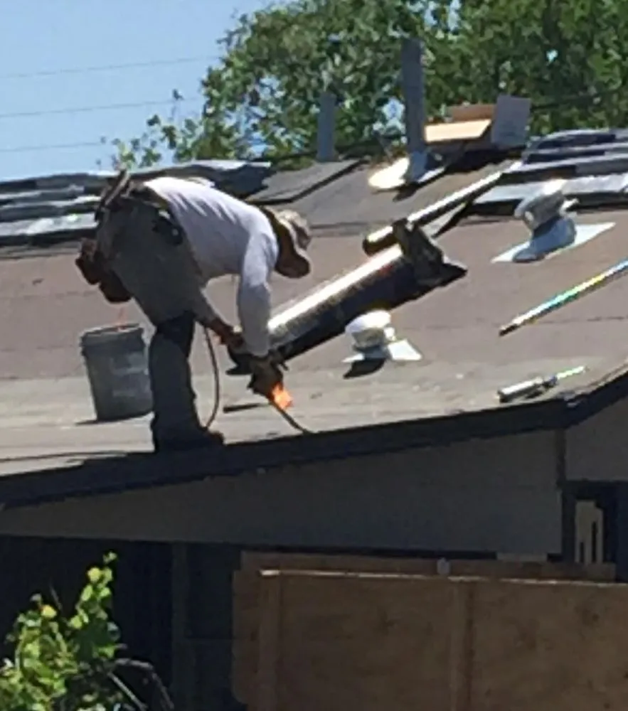 Slide of Abode Roofing