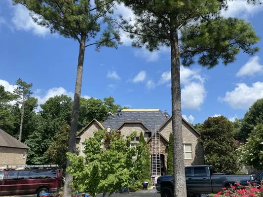 Above All Roofing Professionals Logo