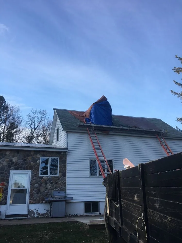 Licensed flat roof repair after storm damage in Solon Springs, WI by Ace Builders