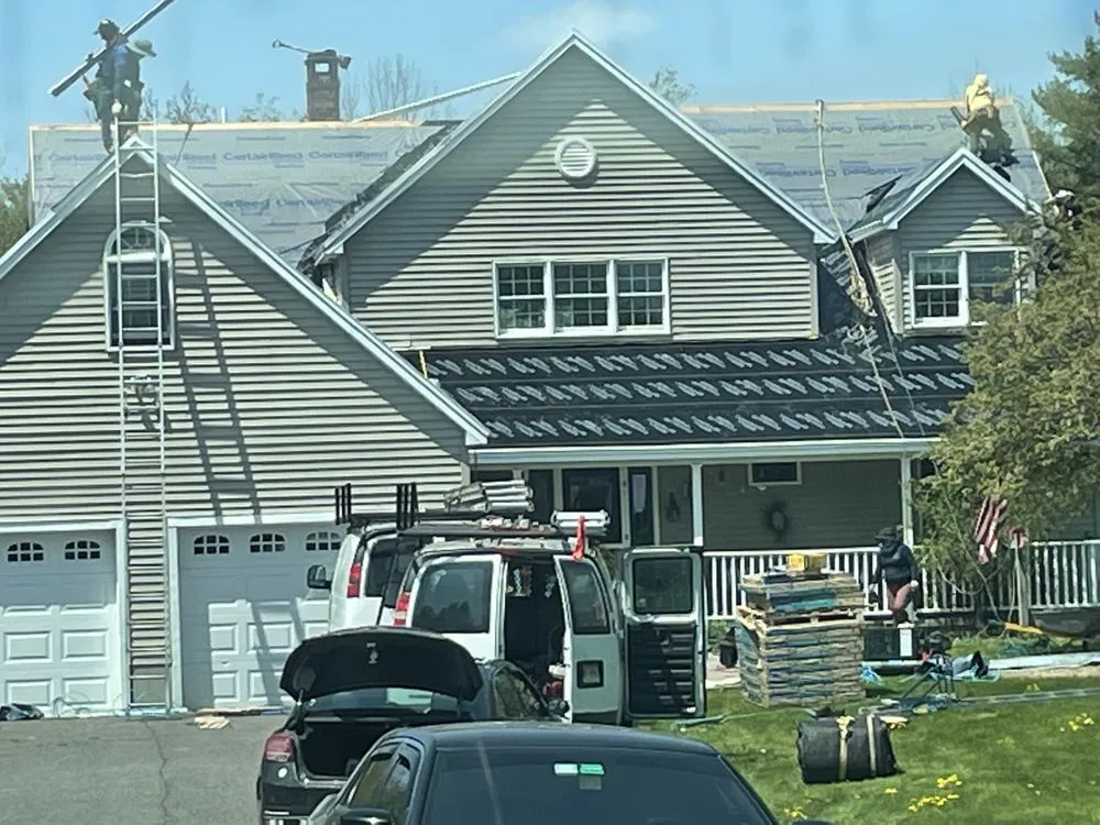 Slide of Action Roofing & Construction