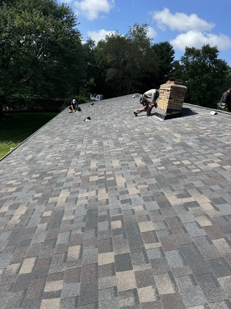 Slide of Action Roofing & Siding