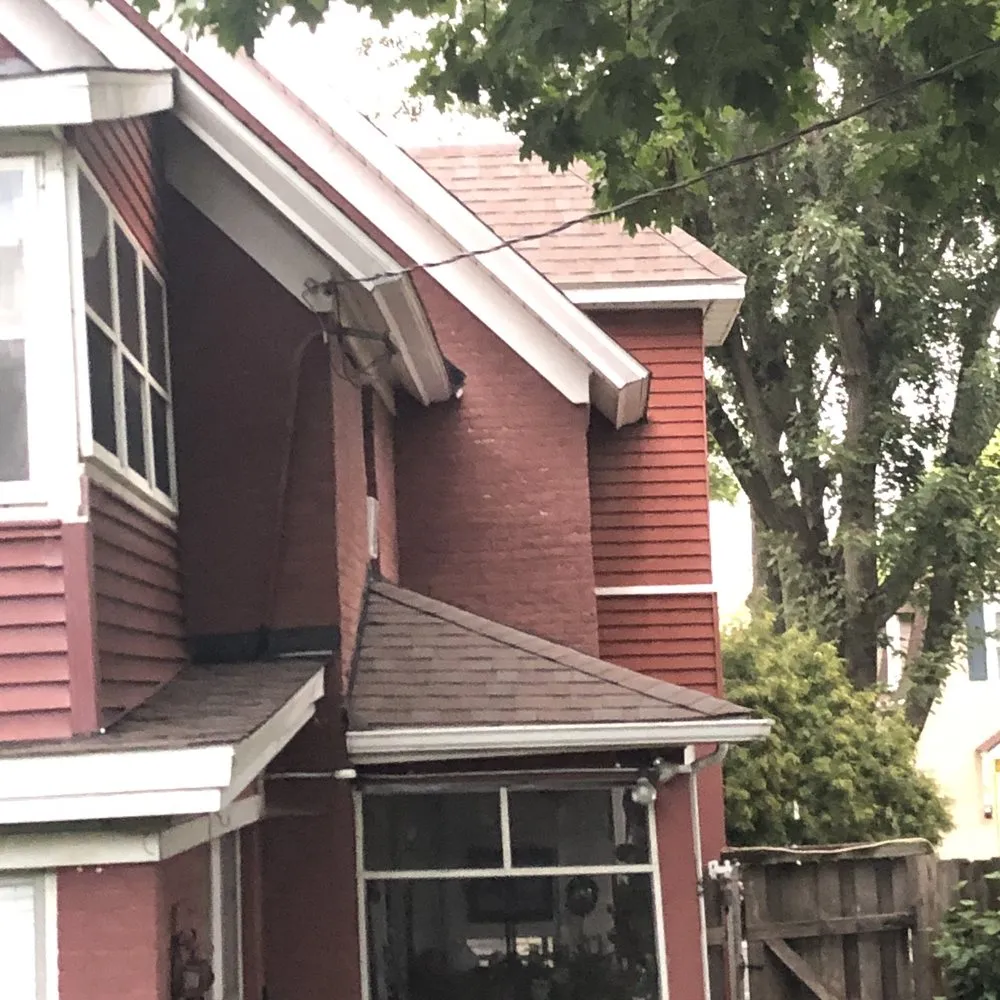 Slide of Action Roofing & Siding