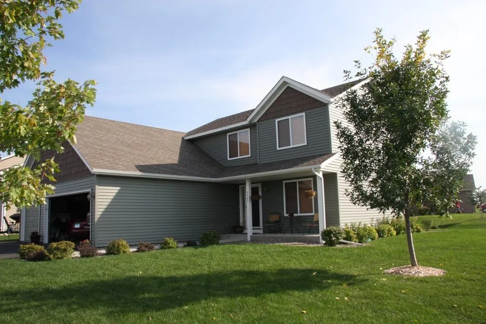 Slide of Action Roofing & Siding