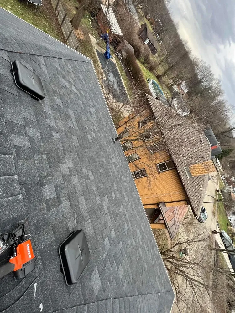 Slide of Acute Roofing