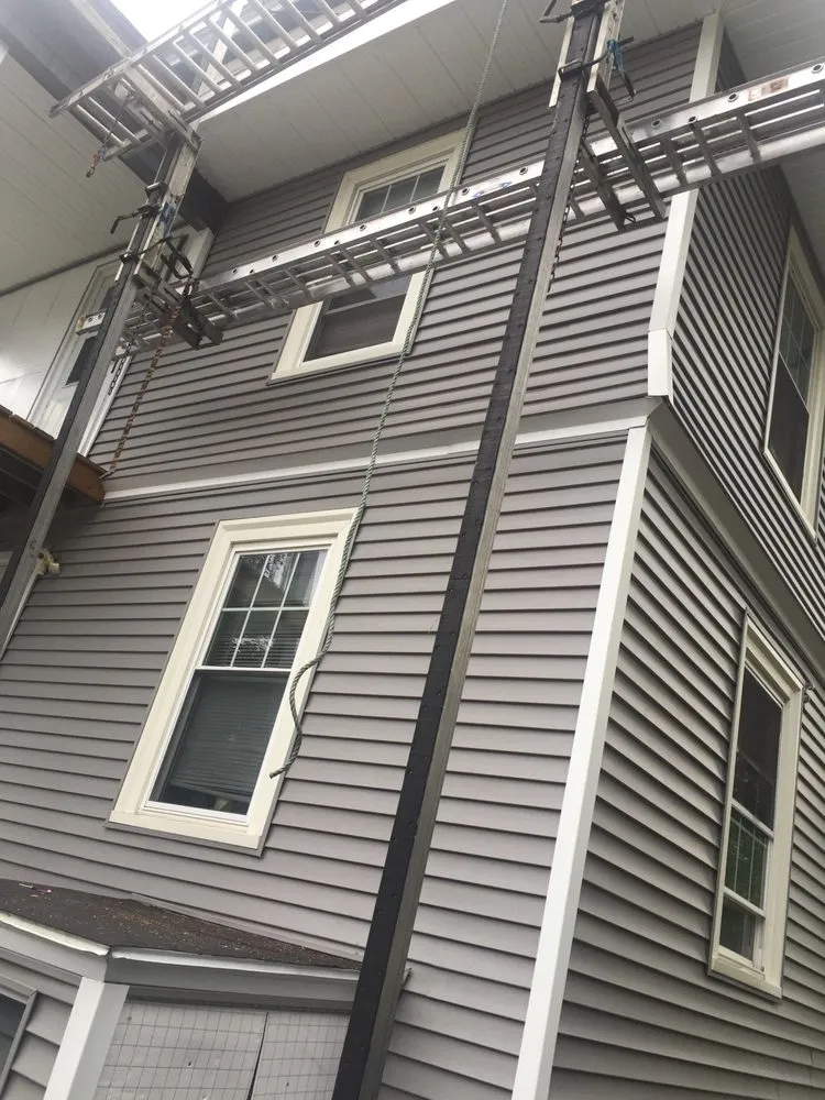 Slide of Adam Roofing