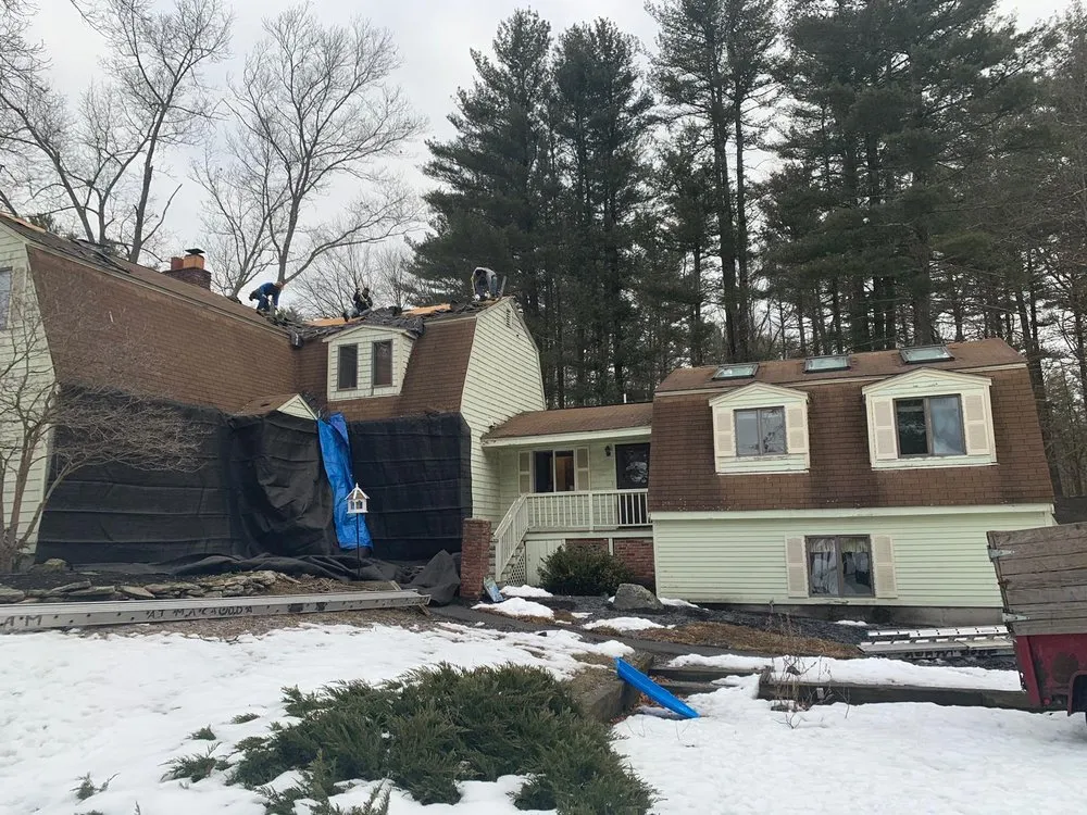 Slide of Adam Roofing