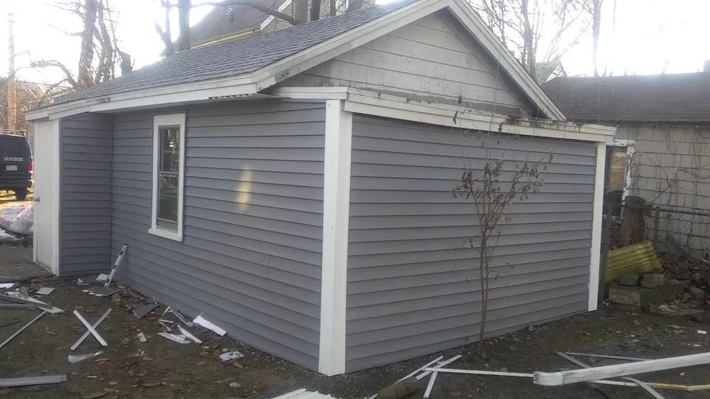 Slide of Adam Roofing