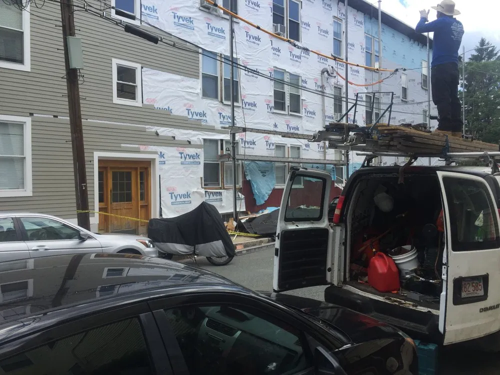 Slide of Adam Roofing