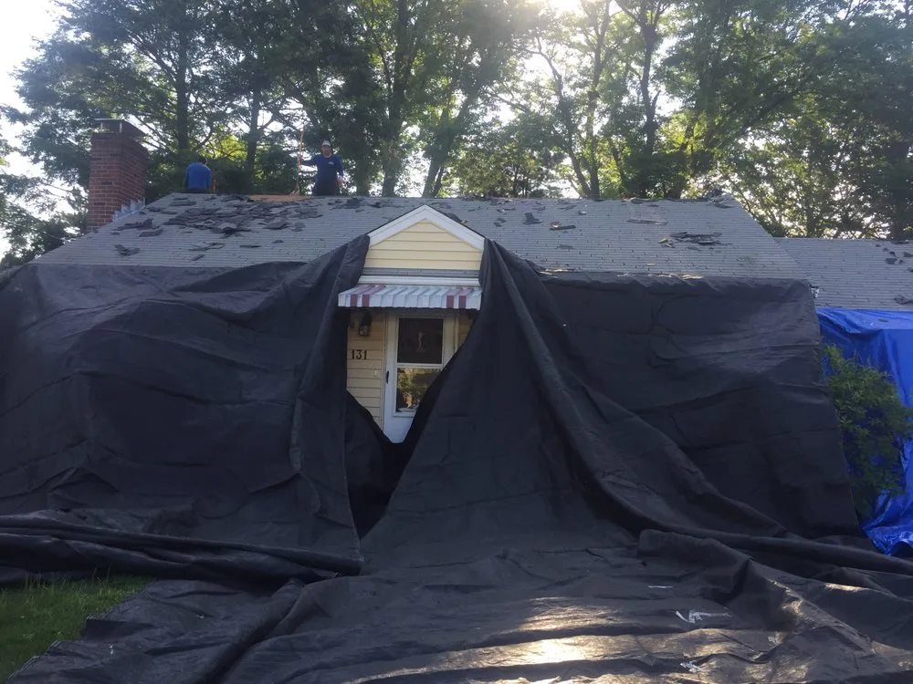 Slide of Adam Roofing