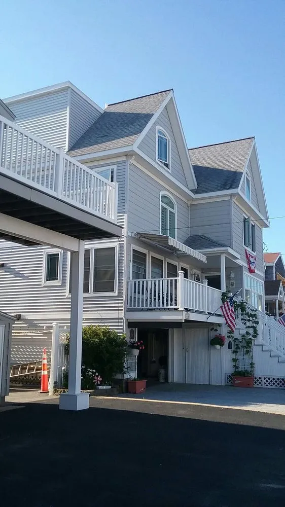 Slide of Adam Roofing