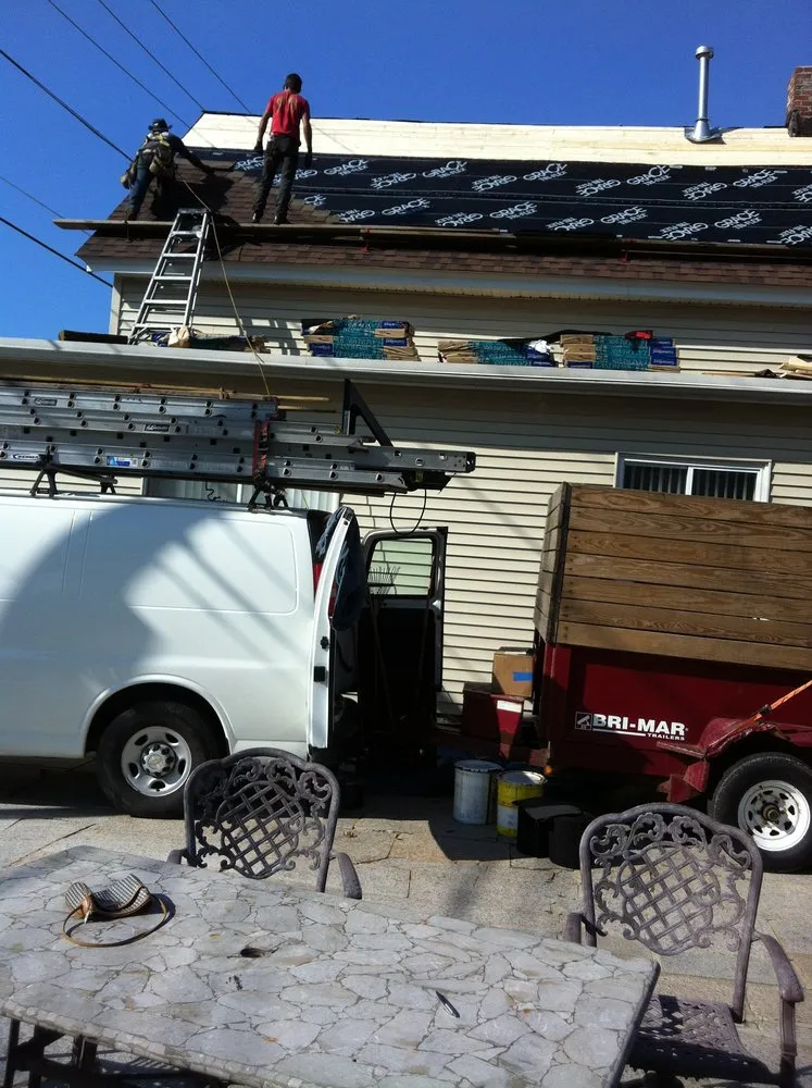 Slide of Adam Roofing