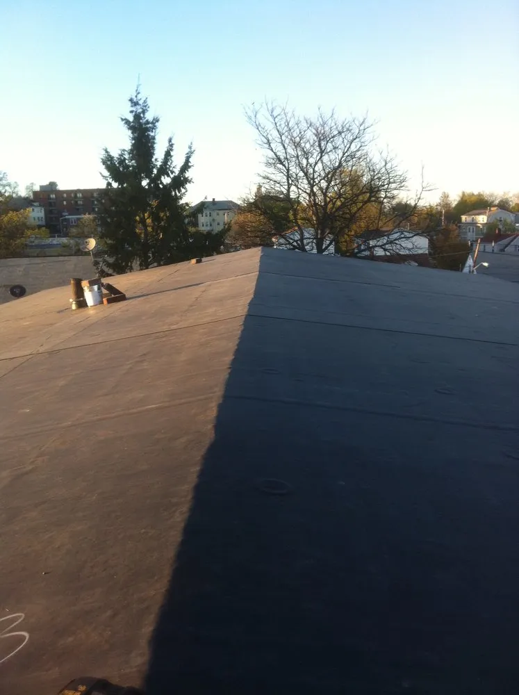 Slide of Adam Roofing