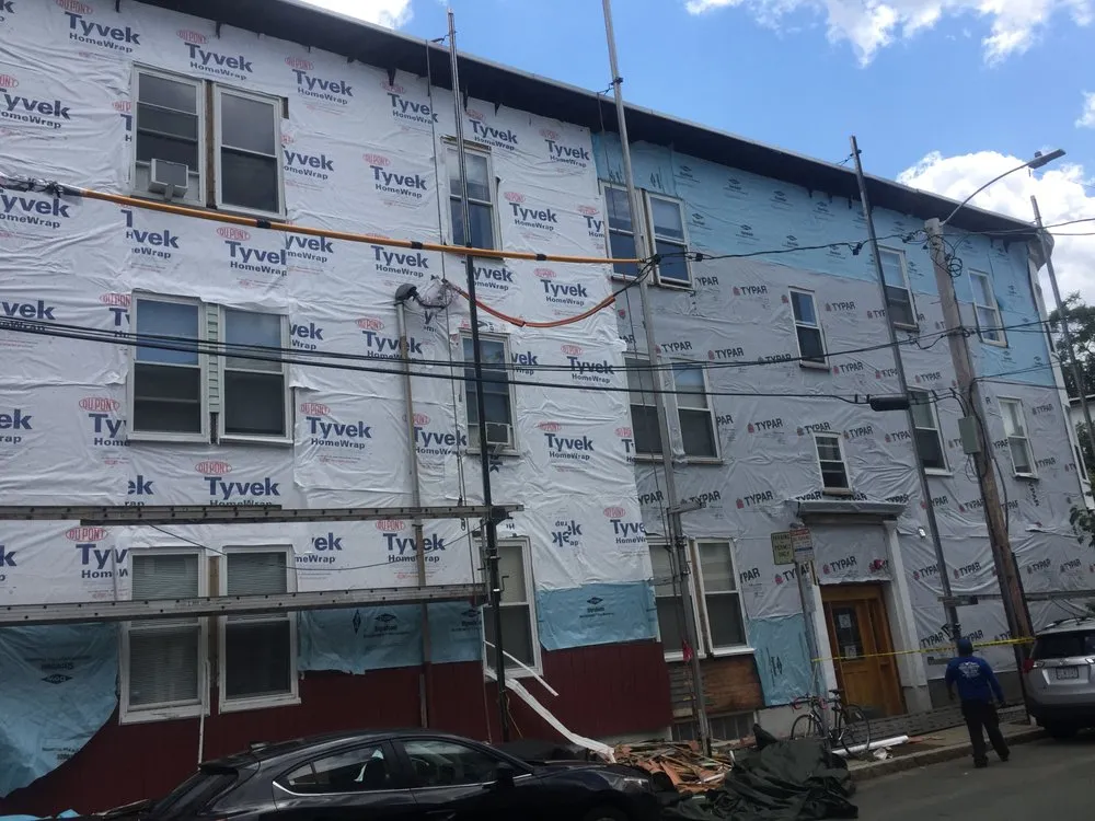 Slide of Adam Roofing