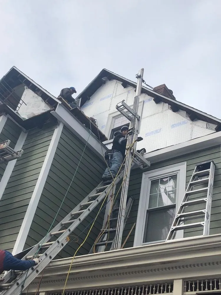 Slide of Adam Roofing