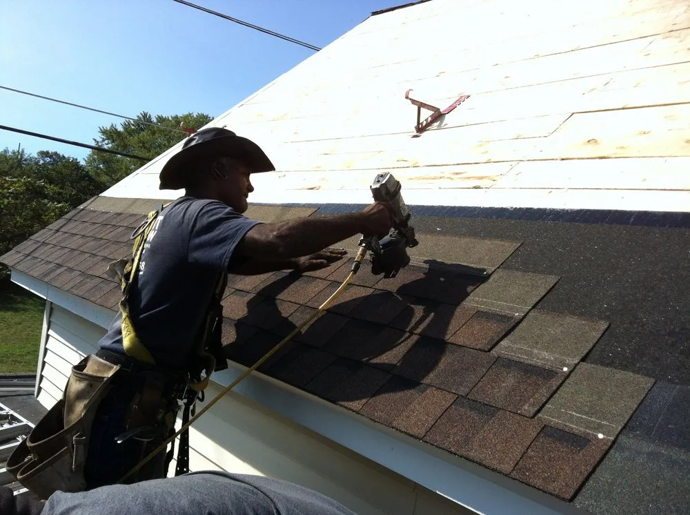 Slide of Adam Roofing