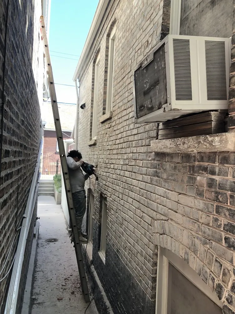 Slide of Adams Roofing & Tuckpointing