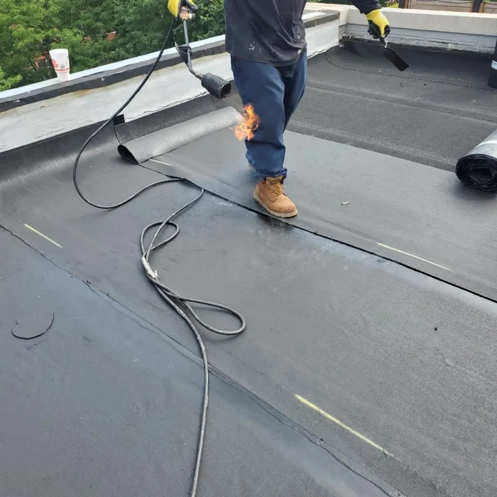 Slide of Adams Roofing & Tuckpointing