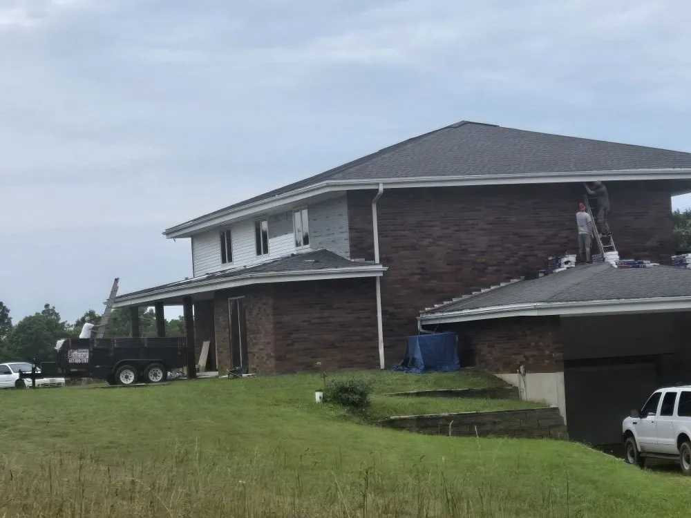 Slide of Adams Roofing