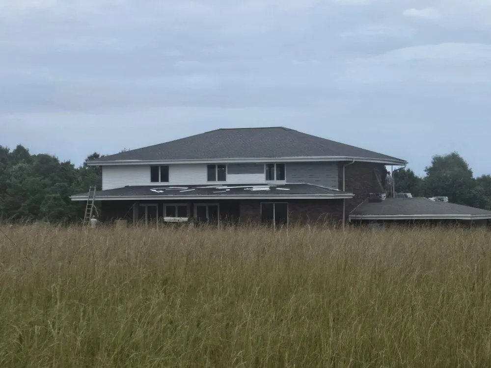 Slide of Adams Roofing