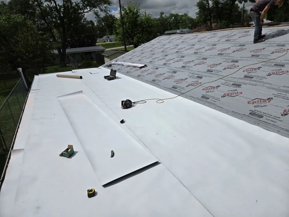 Slide of Adams Roofing