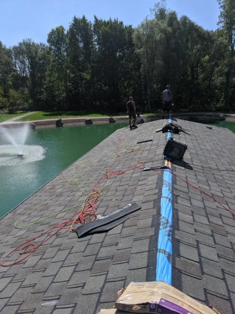 Slide of Adonis Roofing