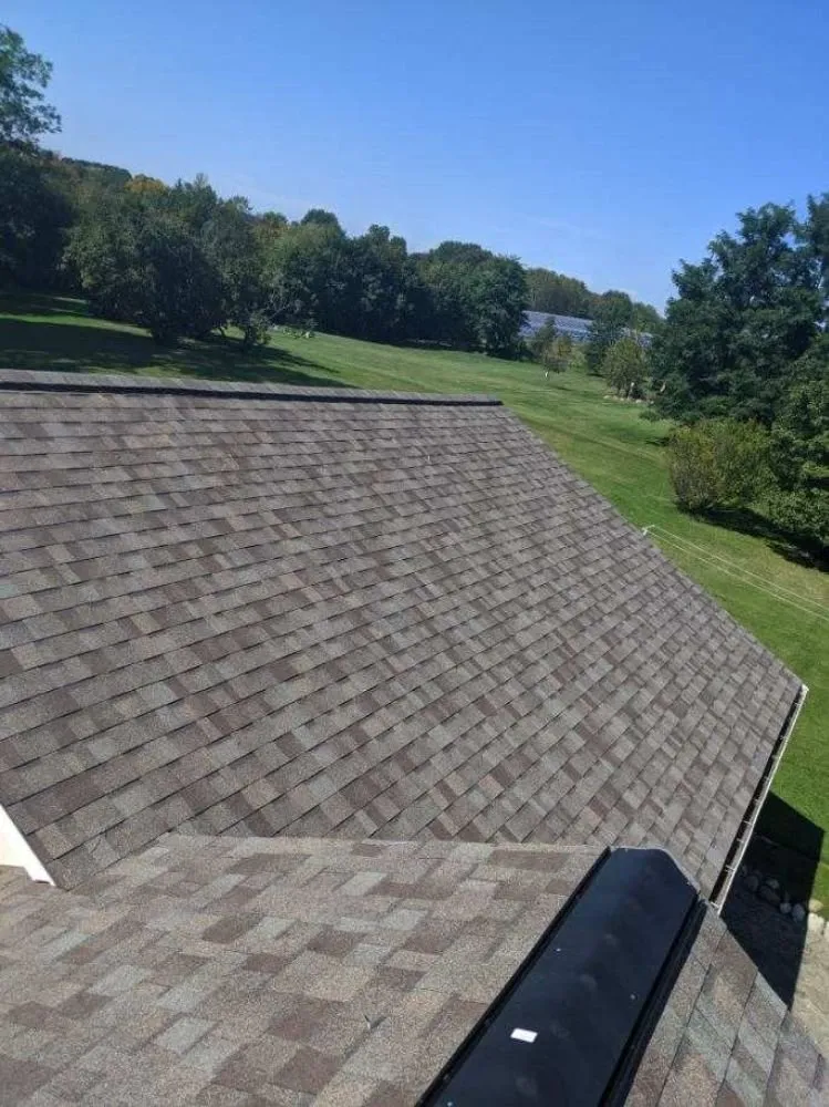 Slide of Adonis Roofing