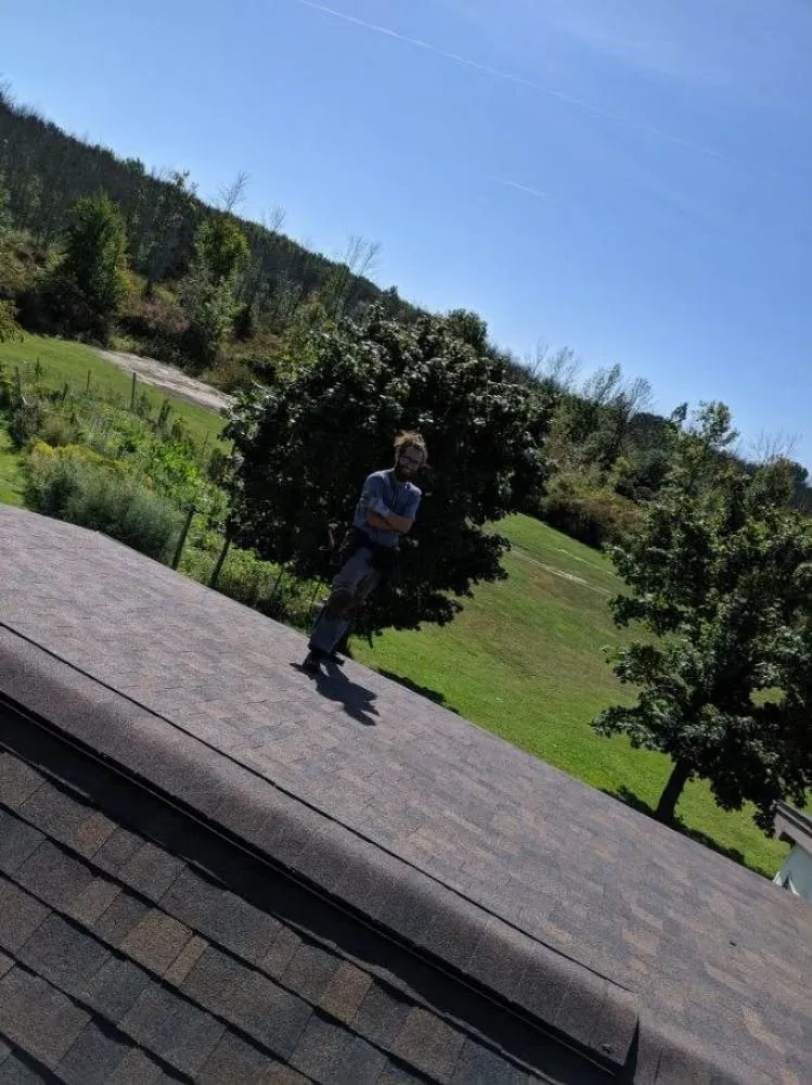 Slide of Adonis Roofing