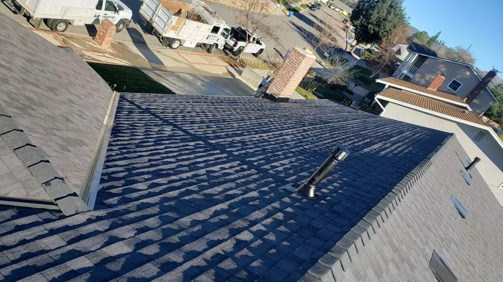 Slide of AE Roofing Experts