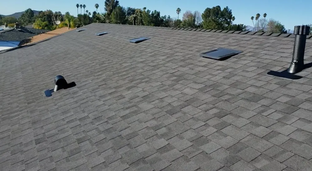 Slide of AE Roofing Experts