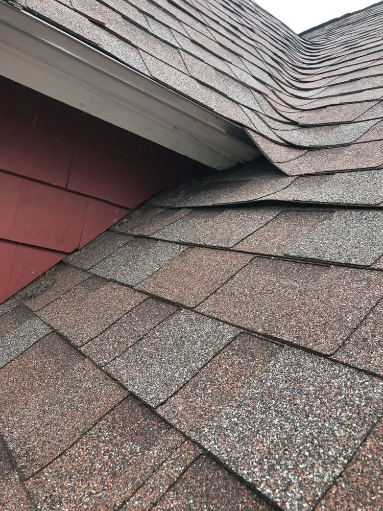 Slide of Agelis Roofing