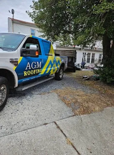 Slide of AGM Roofing