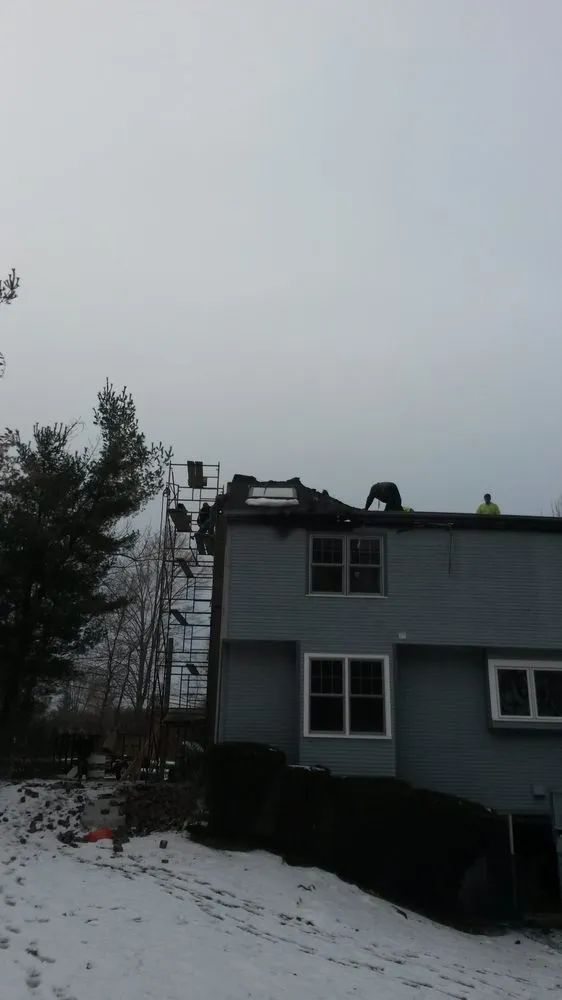 Slide of AJS Restoration & Construction