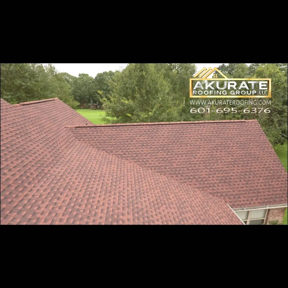 Slide of Akurate Roofing Group