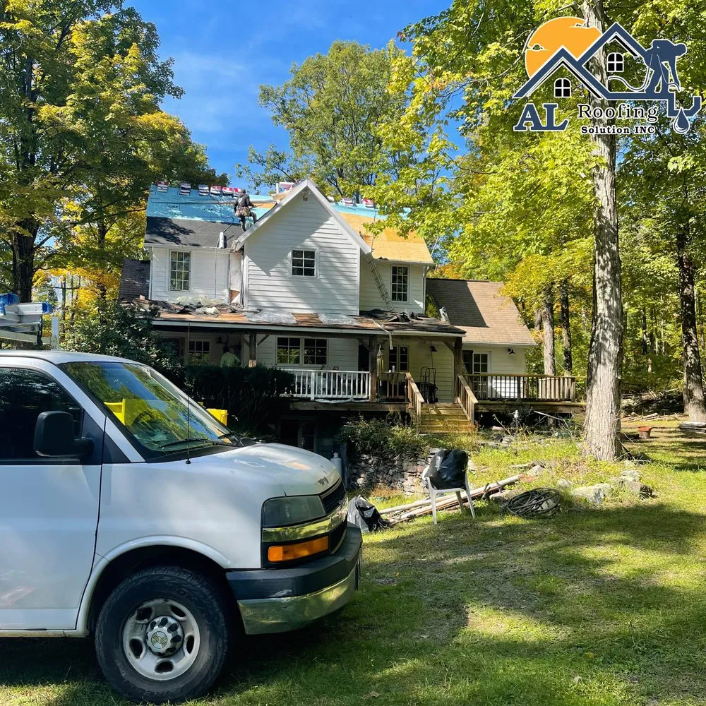 Slide of AL Roofing Solutions