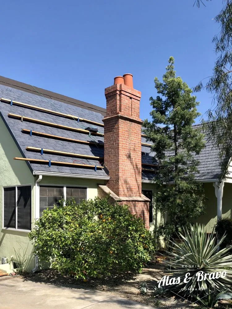 Slide of Alas & Bravo Roofing Company