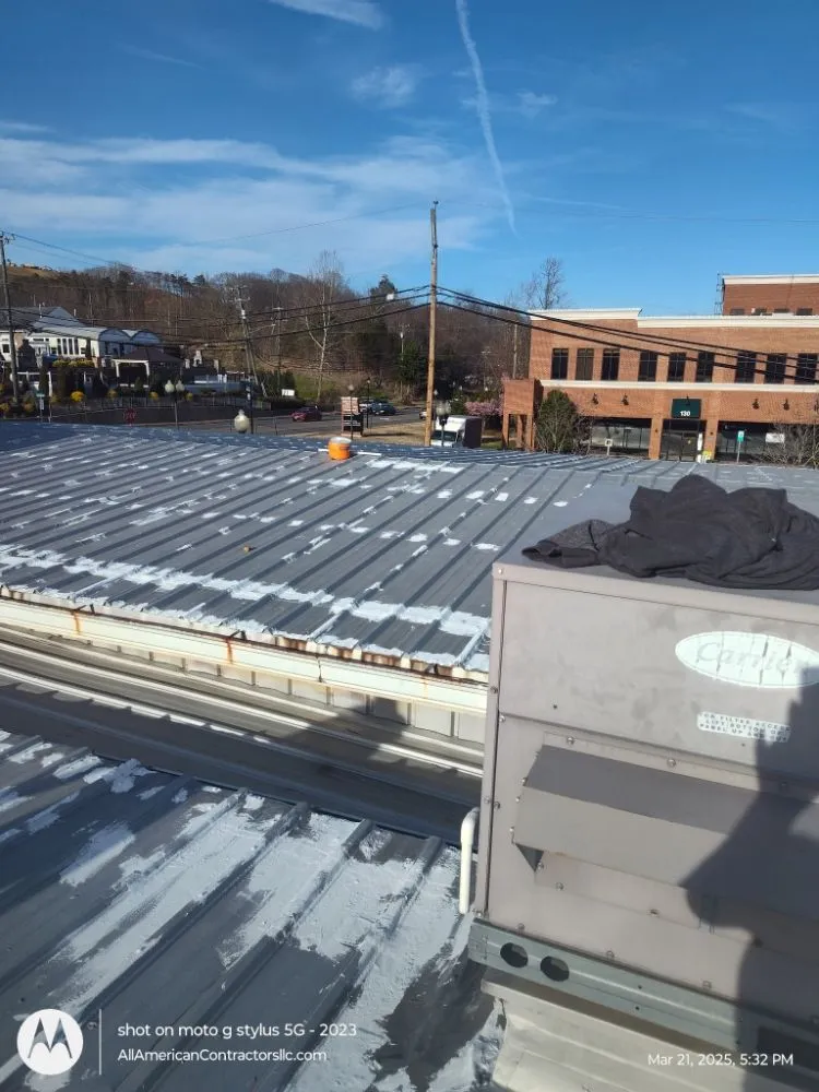 Slide of All American Contractors