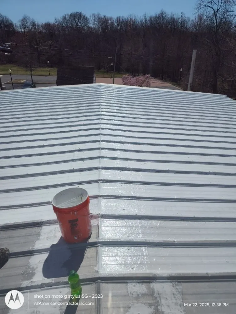 Slide of All American Contractors