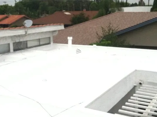 Slide of All Weather Insulated Roof Coating Services