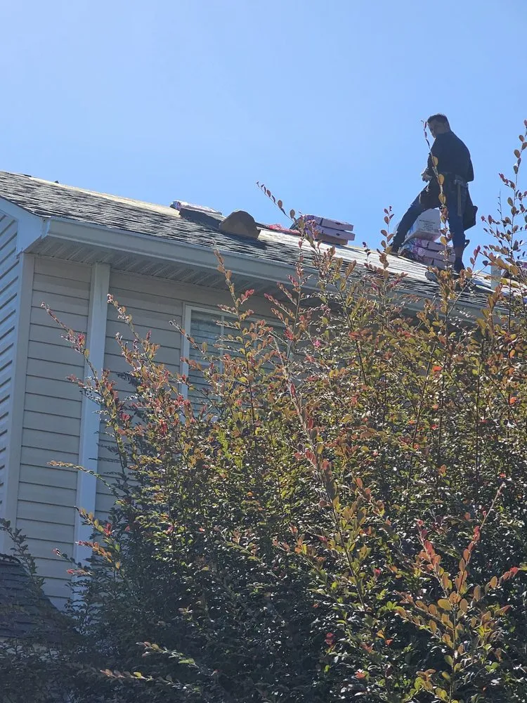 Slide of Amazing Roofing Team