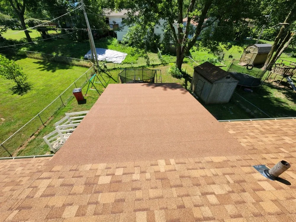Trusted storm damage roof repair in Lee's Summit, MO by Andersen Roofing and Contracting